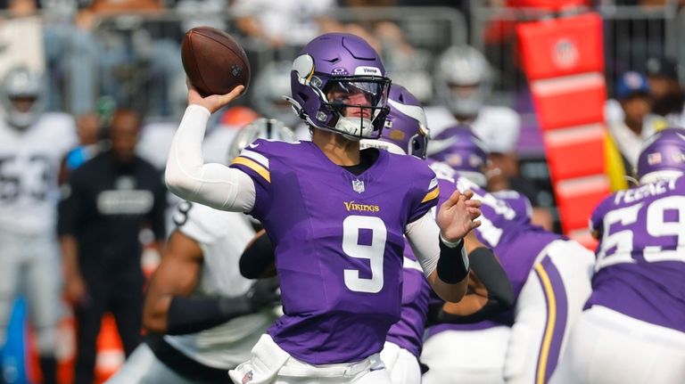 Minnesota Vikings quarterback J.J. McCarthy (9) throws against the Las...