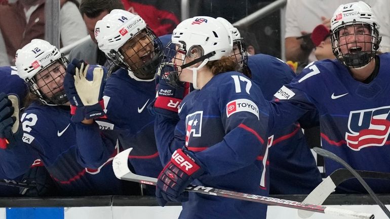 United States forward Britta Curl (17) celebrates with forward Laila...