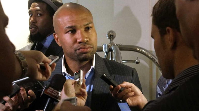 Los Angeles Lakers basketball player Derek Fisher holds a press...