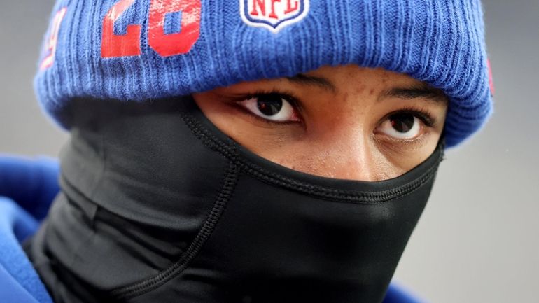 Giants running back Saquon Barkley works out before a game against...