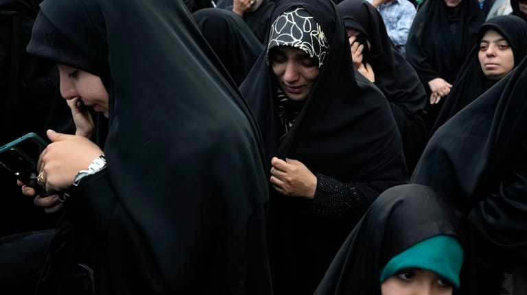 Women attend a mourning ceremony for Iranian President Ebrahim Raisi...