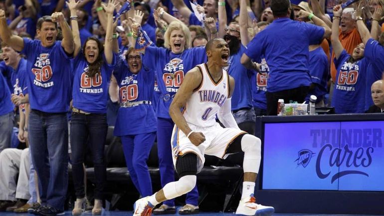 Oklahoma City Thunder guard Russell Westbrook (0) reacts after hitting...