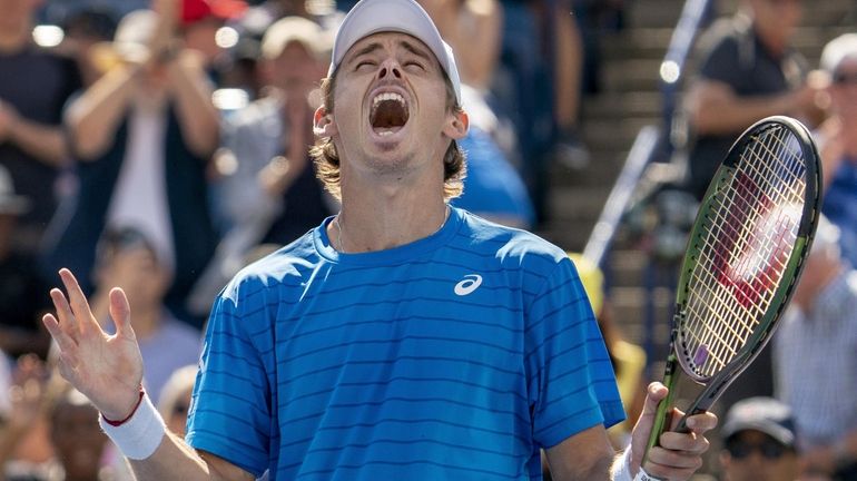 Alex de Minaur, of Australia, celebrates sfter his win over...