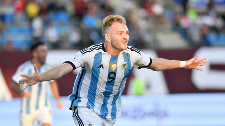 Argentina's Luciano Gondou celebrates after scoring the opening goal against...