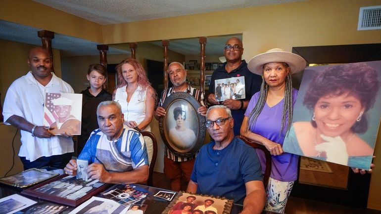 Descendants of Nelson Bell, brothers Milford Fonza, front left, and...