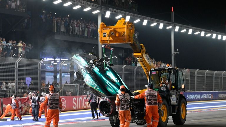 The car of Aston Martin driver Lance Stroll of Canada...