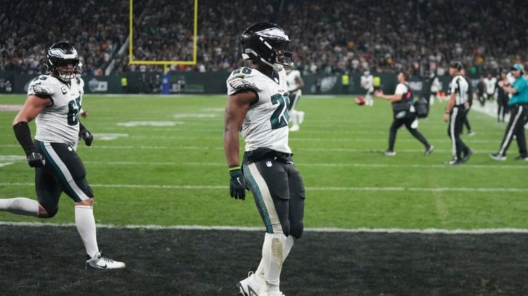 Philadelphia Eagles running back Saquon Barkley (26) celebrates after scoring...