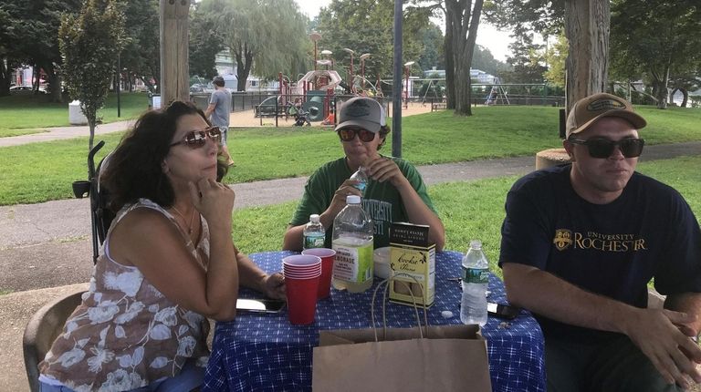 Janice Canfield, 52, of Northport, and her sons Cameron and...