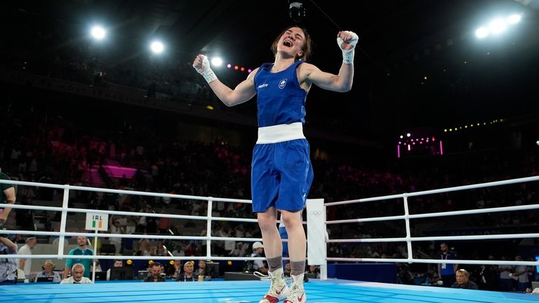 Ireland's Kellie Harrington celebrates winning gold after defeating China's Yang...