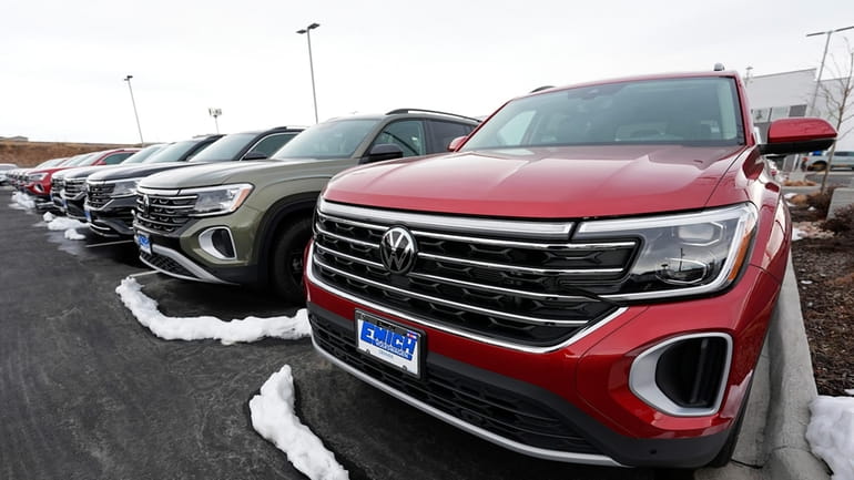 A line of unsold 2024 Atlas sports-utility vehicles sits at...