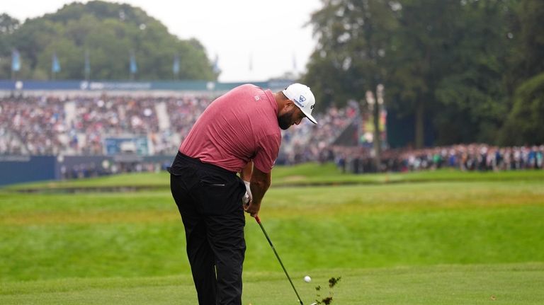 Spain's Jon Rahm approaches the 18th green during day four...