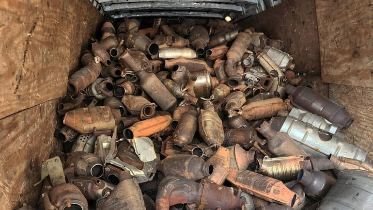 A van containing seized catalytic converters that were stolen is shown...