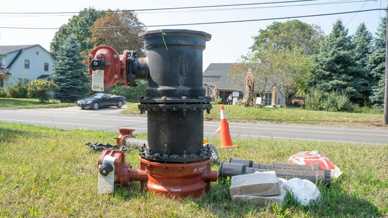 The Suffolk County Water Authority is installing new equipment on Main...