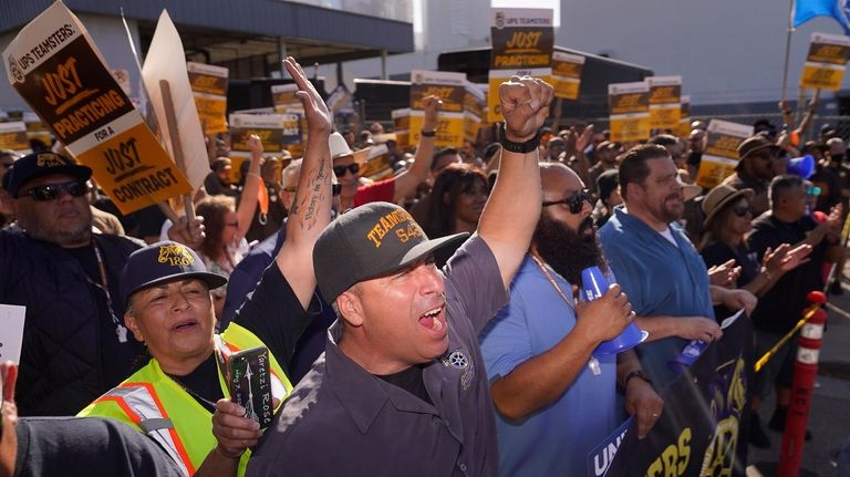 UPS teamsters and workers hold a rally in downtown Los...