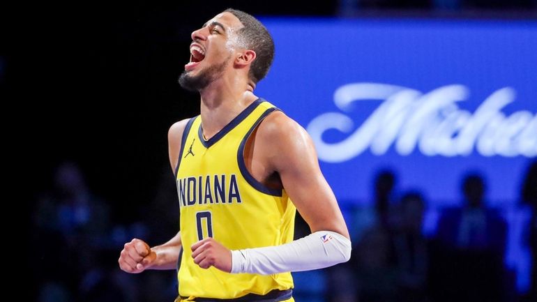 Indiana Pacers guard Tyrese Haliburton (0) yells after a play...