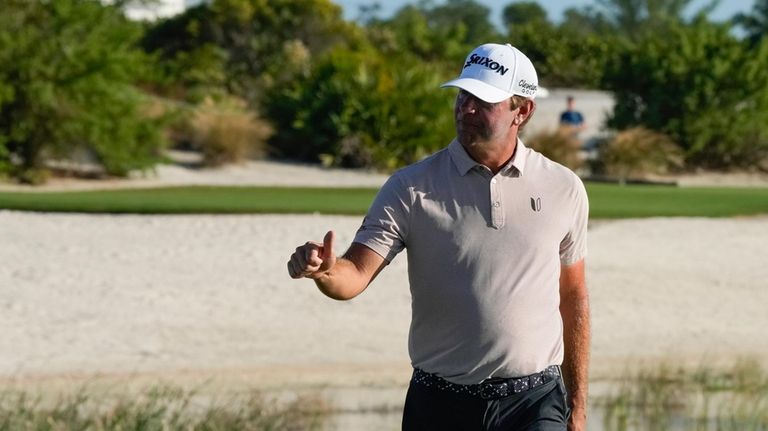 Lucas Glover, of the United States, flashes a thumbs up...