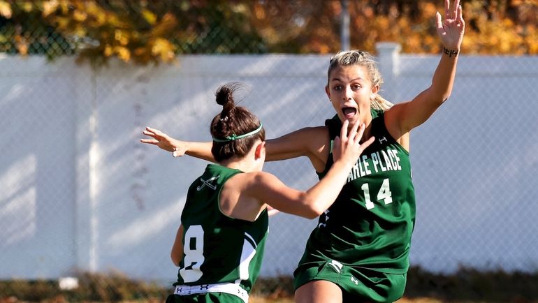 Carle Place midfield Isabella Cuhna (left) celebrates her game winning...