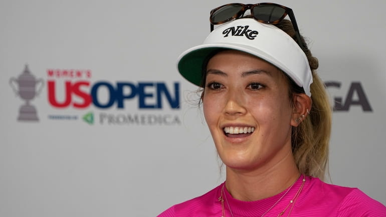 Michelle Wie West speaks during a news conference after a...