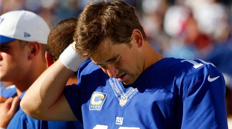 Eli Manning of the New York Giants looks on from...