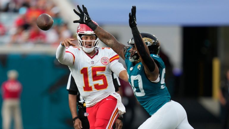 Kansas City Chiefs quarterback Patrick Mahomes (15) throws as Jacksonville...