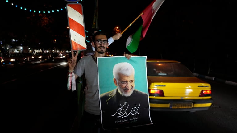 A supporter of Saeed Jalili, a candidate for the presidential...