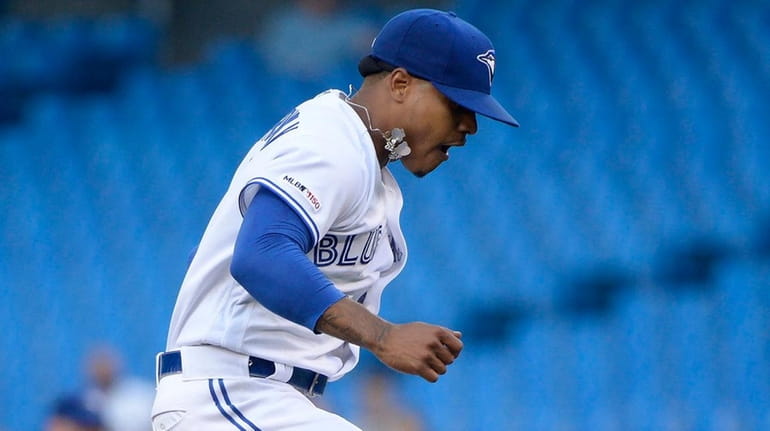 Marcus Stroman reacts after Indians shortstop Francisco Lindor, not shown,...