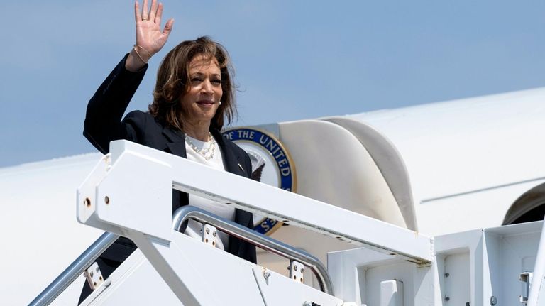 Democratic presidential nominee Vice President Kamala Harris boards Air Force...