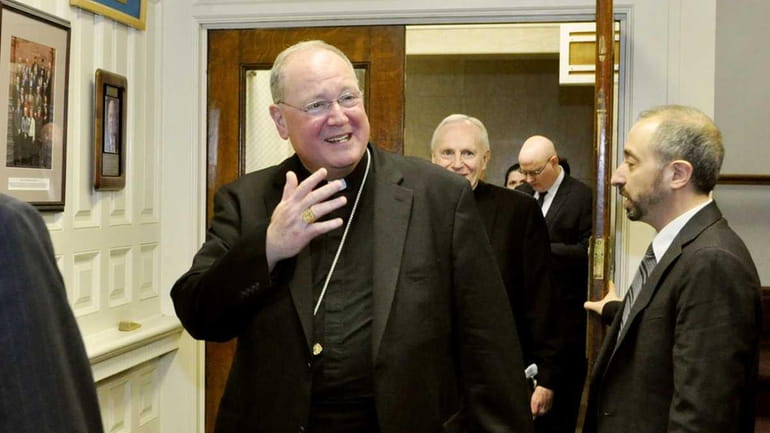Cardinal Timothy Dolan leaves a meeting with New York Gov....