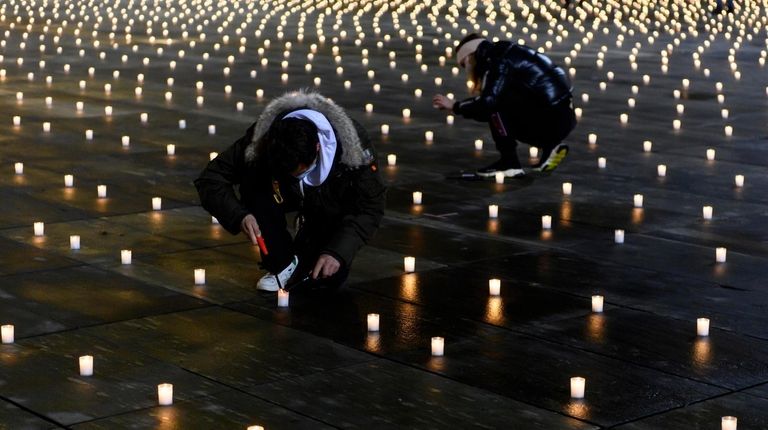 Activists lit about 5,000 candles in Bern, Switzerland, on Sunday to commemorate...