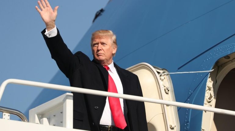 President Donald Trump boards Air Force One at Andrews Air...