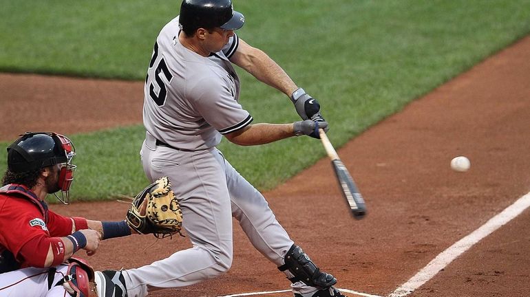 Mark Teixeira connects for a three-run home run in the...