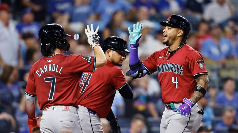 Arizona Diamondbacks' Ketel Marte (4) celebrates hitting a three-run home...