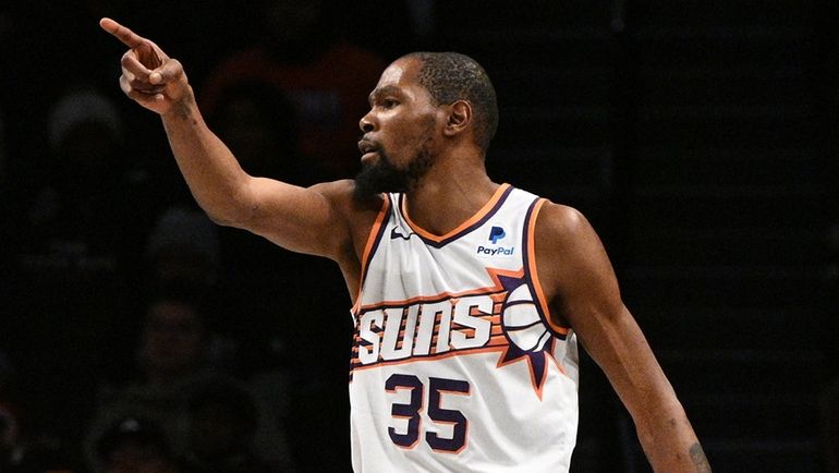 Suns forward Kevin Durant gestures in the first half of...