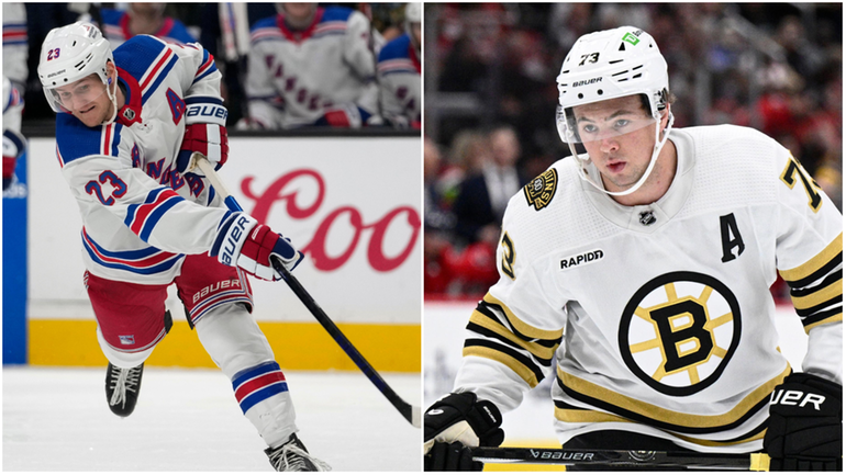 The Rangers' Adam Fox, left, and the Bruins' Charlie McAvoy 