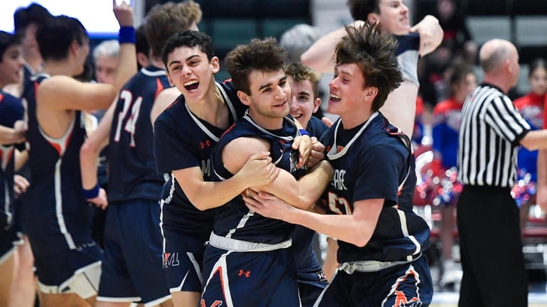 Manhasset's Timmy Colombos, Matt Perfetto and James Kinloch celebrate their...