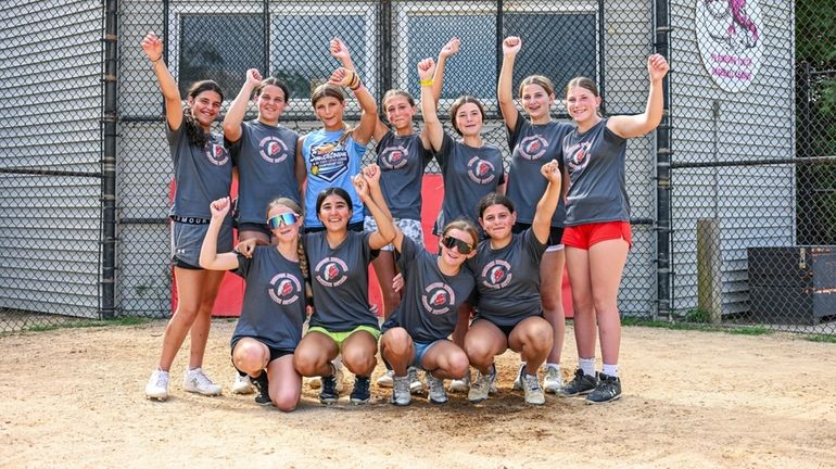 The Massapequa Little League softball team poses during practice on...