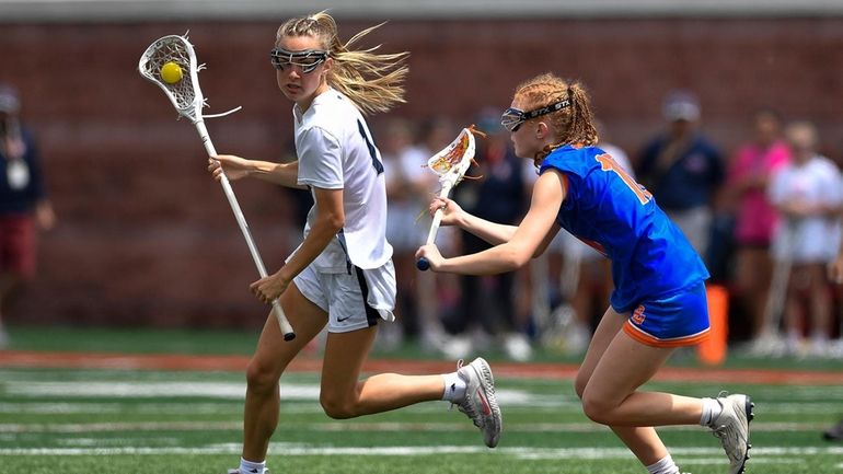 Cold Spring Harbor's Ruby Spielberger, left, is defended by Penn...