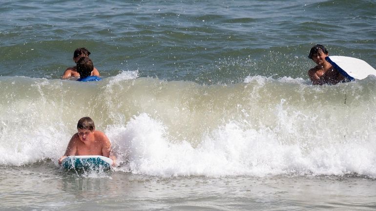 Bathers were allowed back in the water Friday at Tobay...