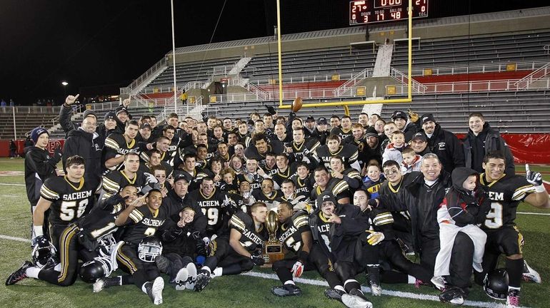 The Sachem North football team has their picture taken after...