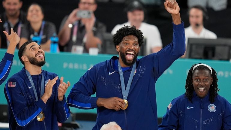 United States' Joel Embiid (11) celebrates after winning a men's...