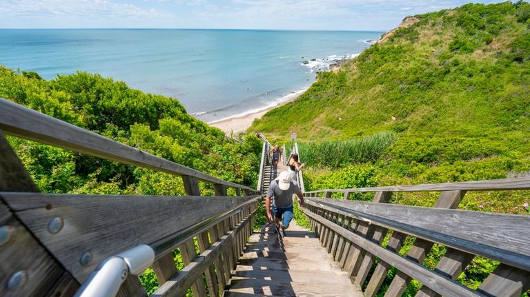 Visitors climb 141 steps at Mohegan Bluffs.