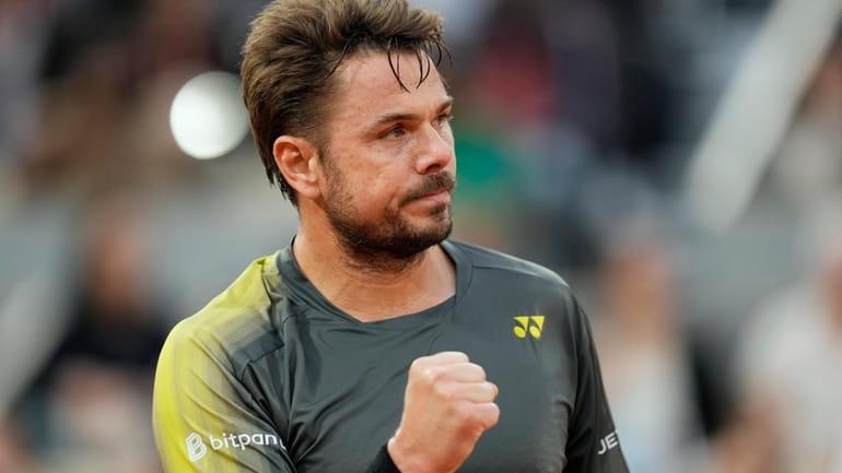 Switzerland's Stan Wawrinka reacts during his first round match against...