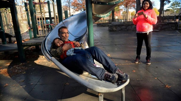 Binu Pushpangedan and his daughter Saanvi, from Plainview come down the twisty...