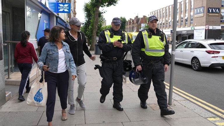 Police on patrol ahead of an anti-immigration protest in North...