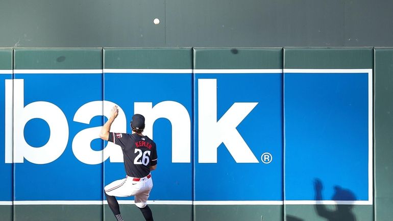 Minnesota Twins right fielder Max Kepler attempts to field the...