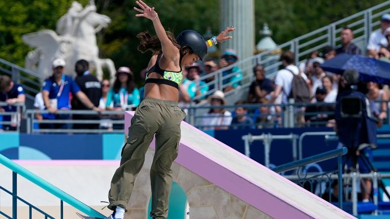 Rayssa Leal, of Brazil, performs a trick during the women's...