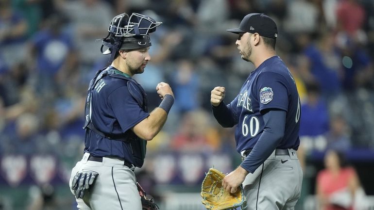 Seattle Mariners relief pitcher Tayler Saucedo (60) and catcher Cal...