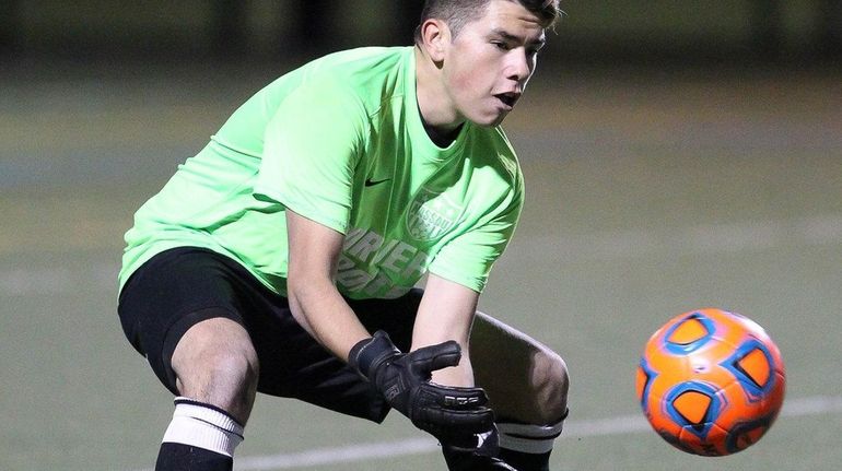 Dennis Mejia of Oyster Bay makes a save for Nassau...