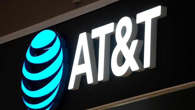 An AT&T sign is seen at a store in Pittsburgh,...
