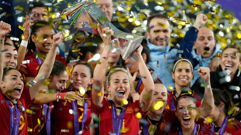 Spain's Alexia Putellas lifts the trophy after winning the Women's...